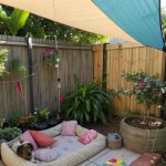 outdoor dog shelter ideas Shade sail dog lounging area