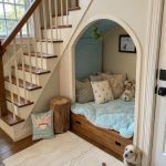 cute dog houses Under stairs nook with plush bedding