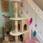under stairs cat room Cat tree with toys galore